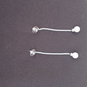 **Crystal and silver tone dangling earrings